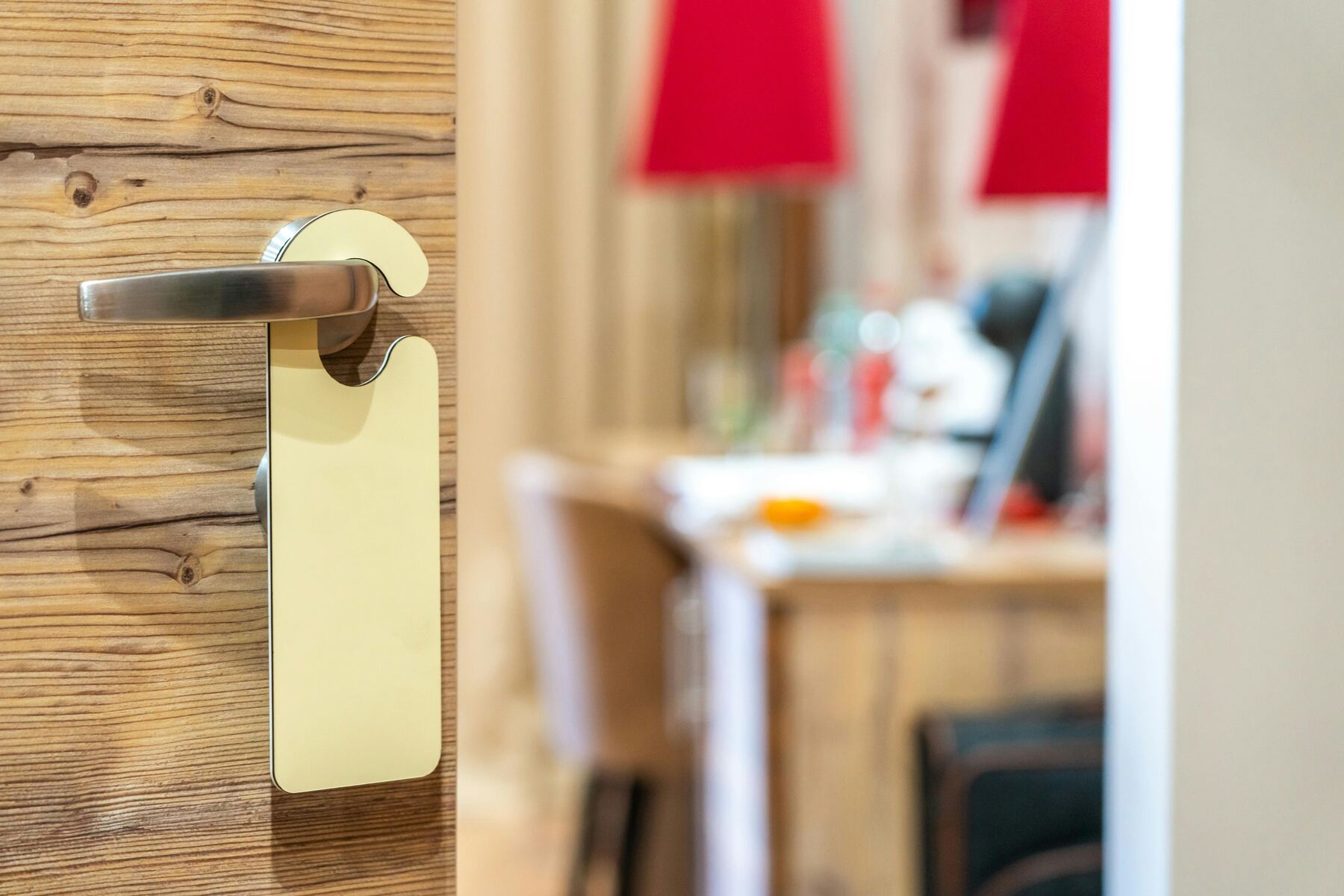 Hotel room door with a hanging sign